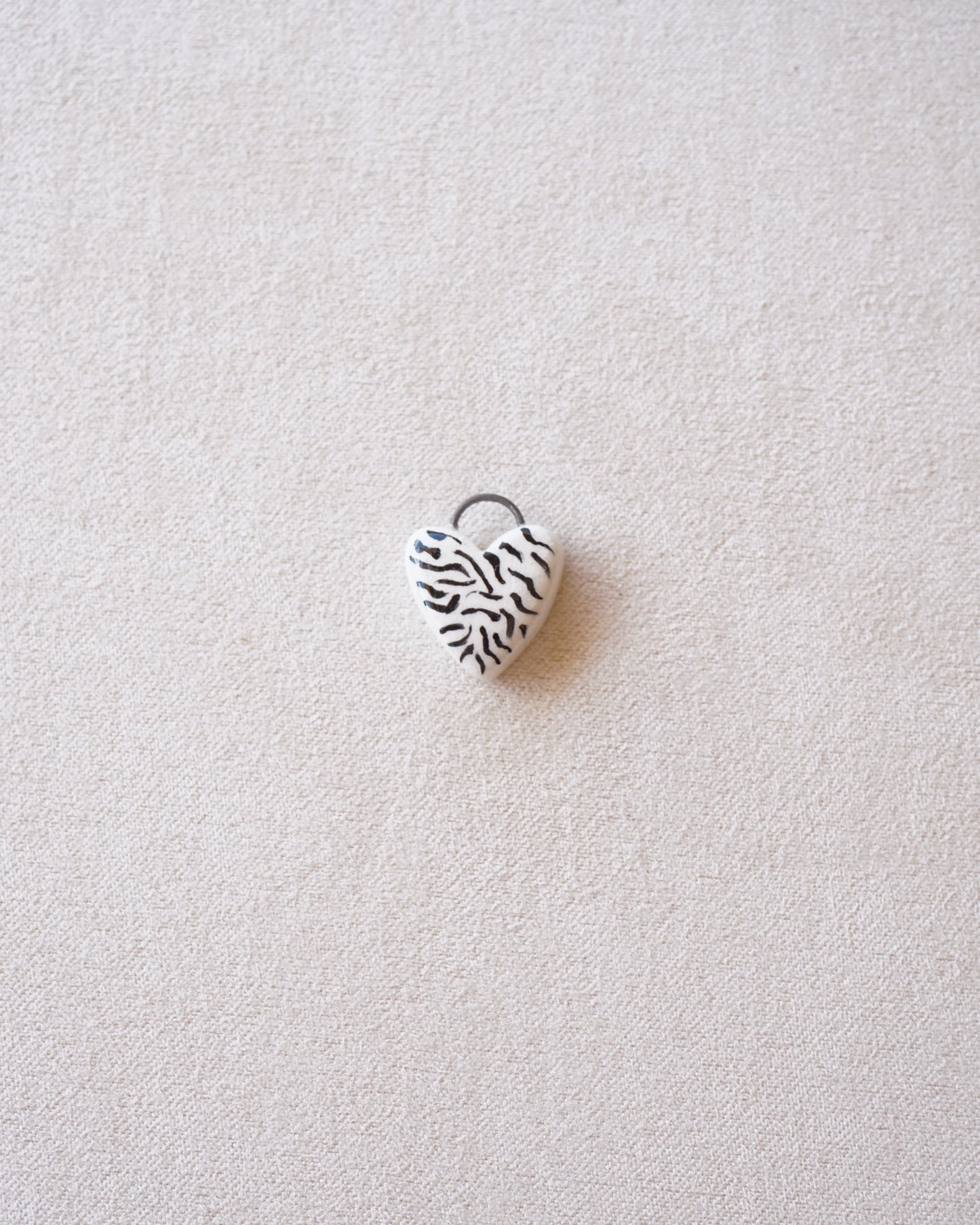 CIONDOLO CUORE ZEBRATO-PREORDINE