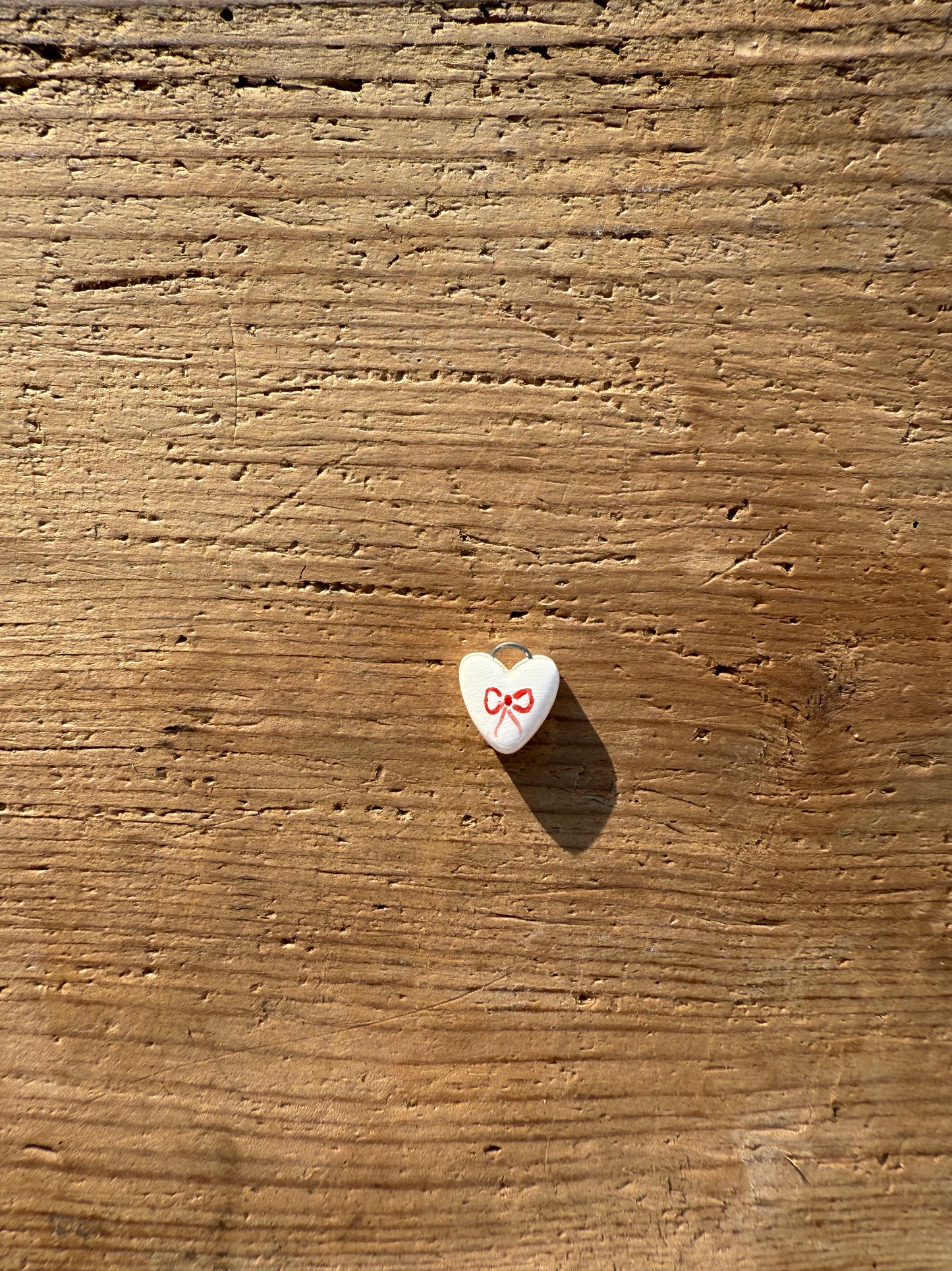 Ciondolo cuore fiocco rosso