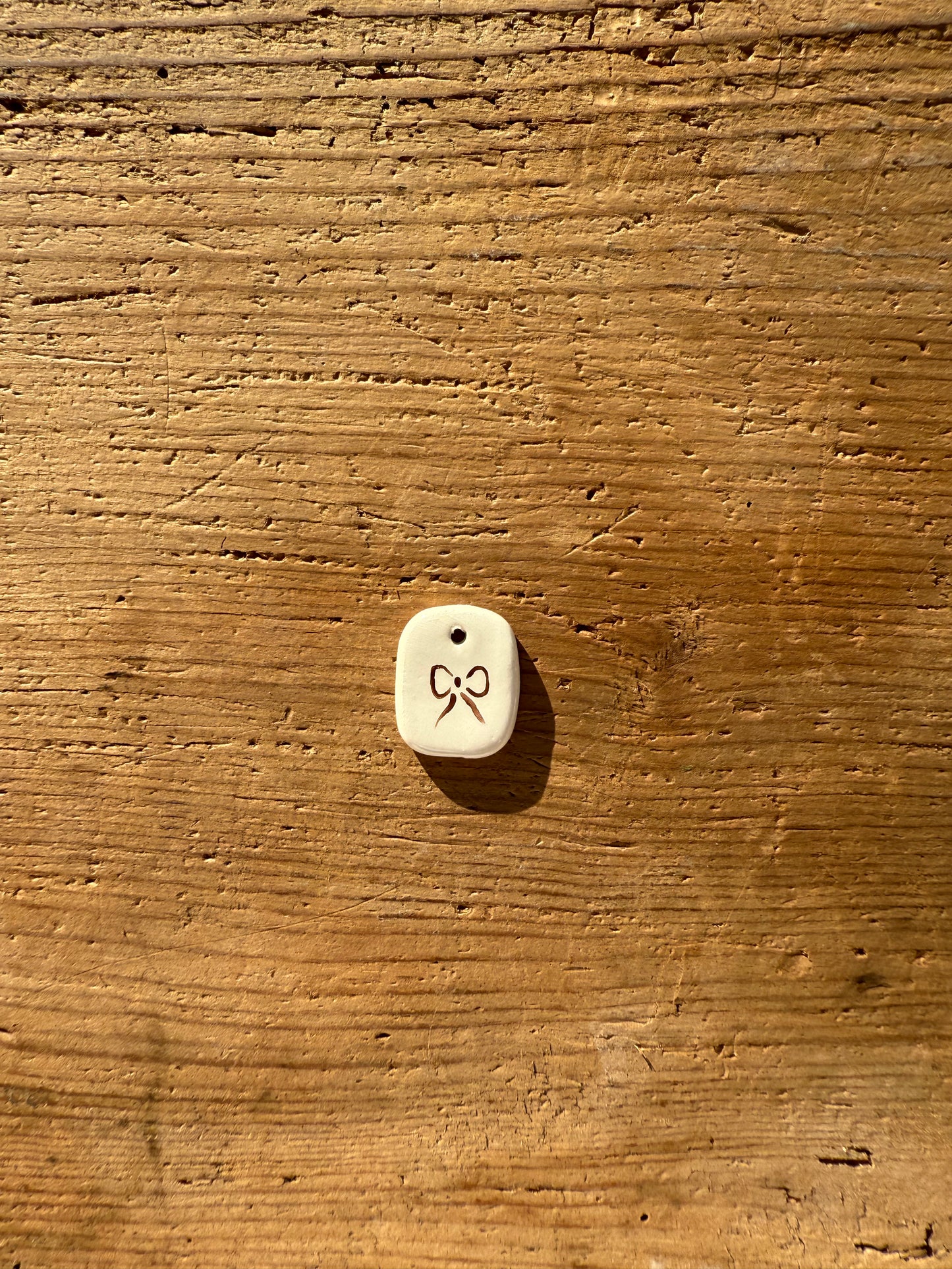 Ciondolo fiocco marrone