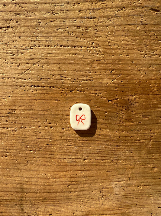 Ciondolo fiocco rosso